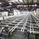 300’ long extrusions cool before cutting and transfer to the drilling stations.