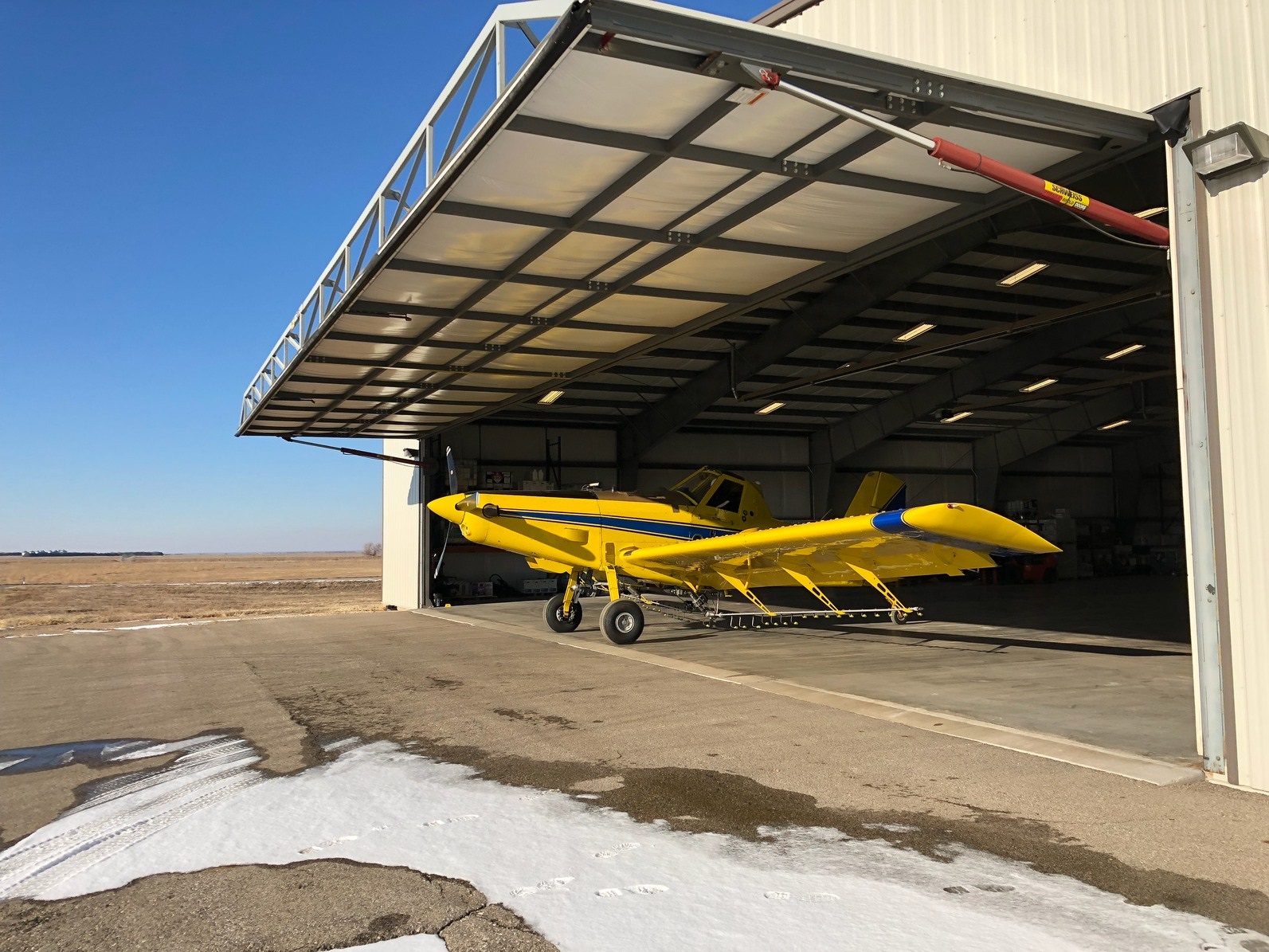 Agtegra Coop Award-winning Aerial Spray Hangar Sports 70-foot Drive-thru Hydraulic Doors from Schweiss