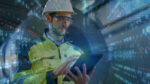 Portrait of Professional Heavy Industry Engineer / Worker Wearin