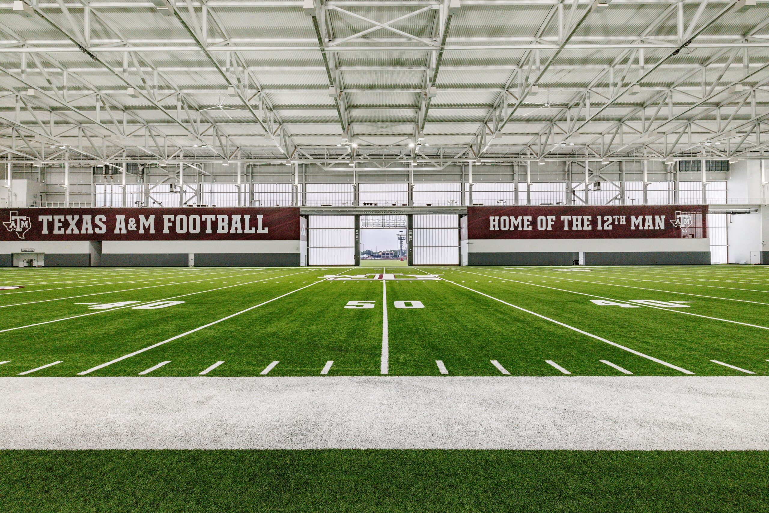 Whether inside or outside, Texas A&M aims for football excellence with a lift from Schweiss Doors