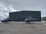 Switchback Helicopters chooses strap over cable for new hangar door Schweiss
