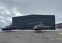 Switchback Helicopters chooses strap over cable for new hangar door Schweiss