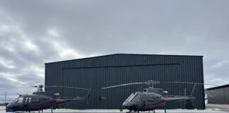 Switchback Helicopters chooses strap over cable for new hangar door Schweiss